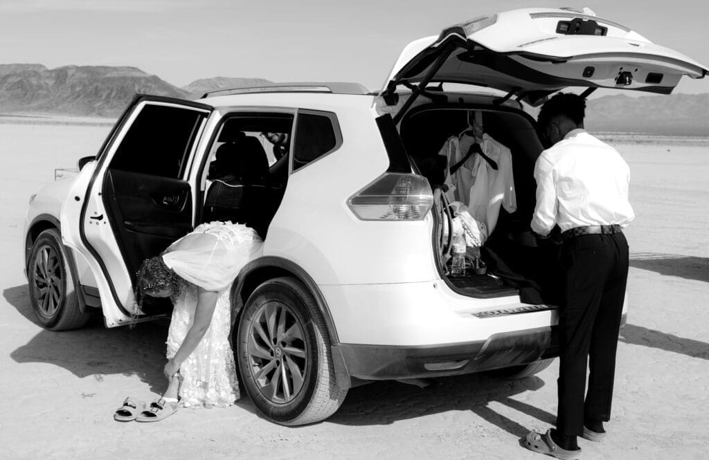 bride and groom getting ready for adventure elopement