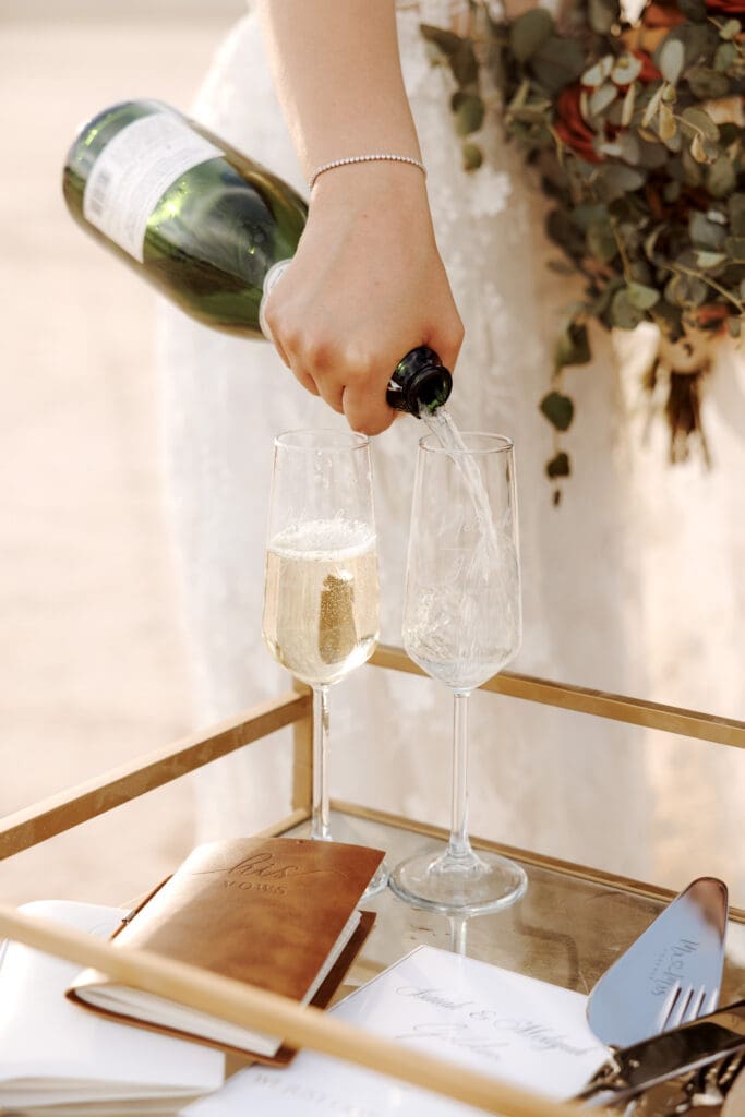 bride pouring champagne
