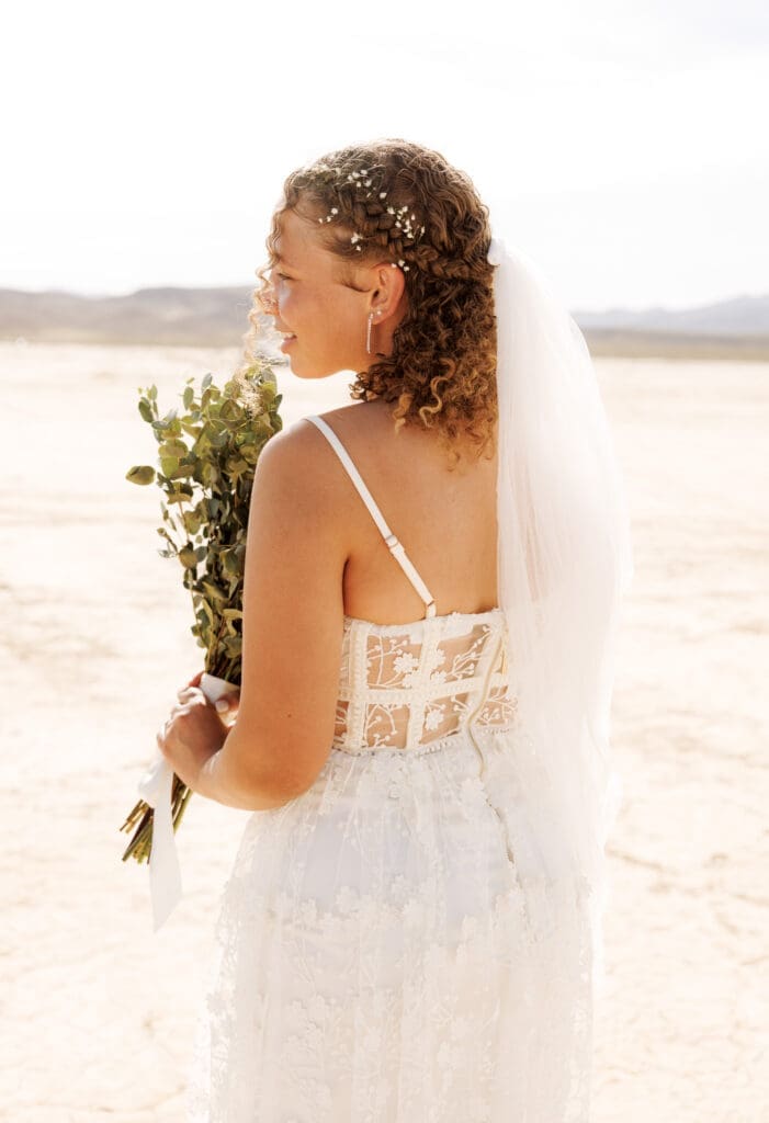bride smiling over her shoulder