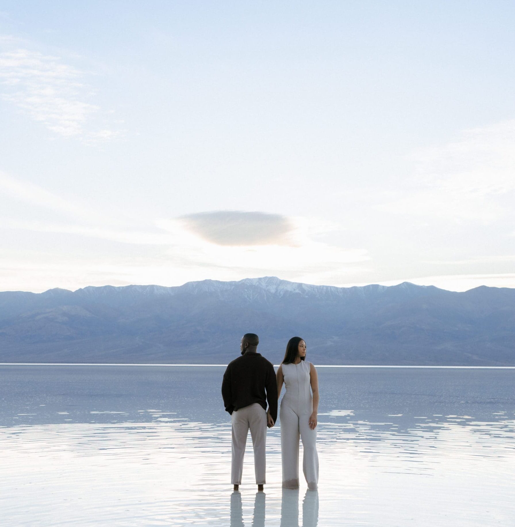 couple standing in lake manly