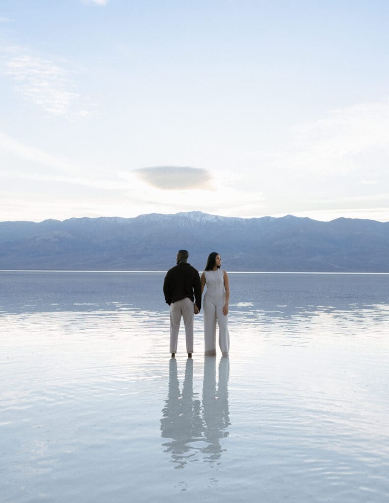 couple standing in lake manly