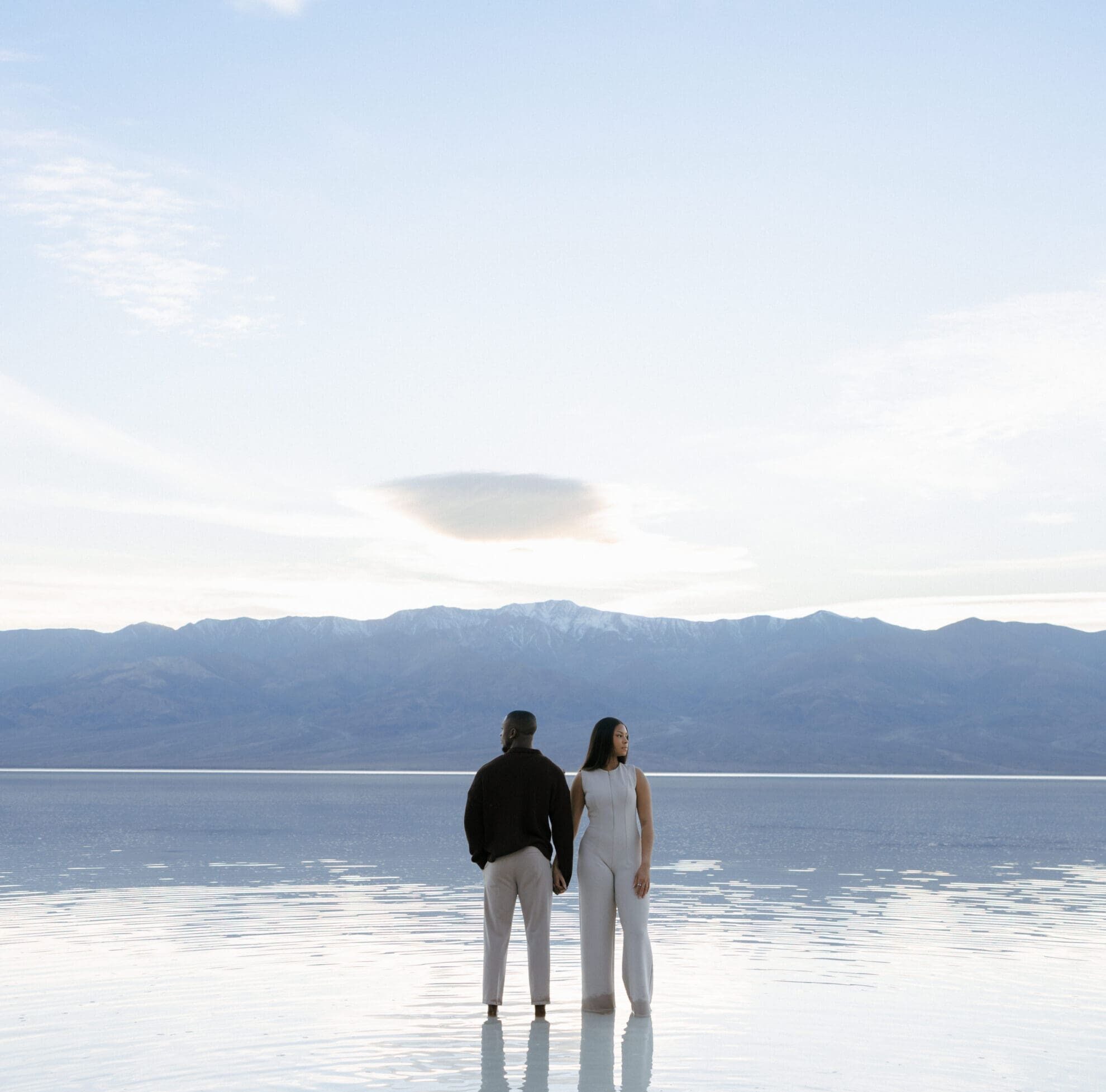 couple standing in lake manly