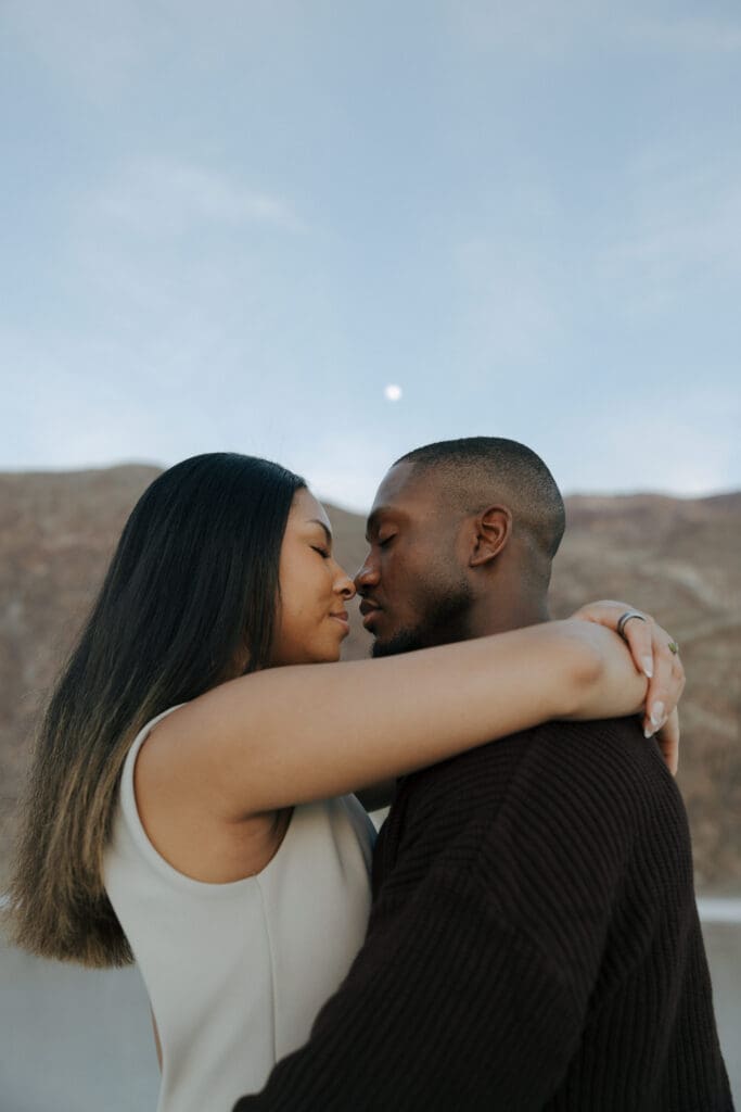 couple kissing under the moon