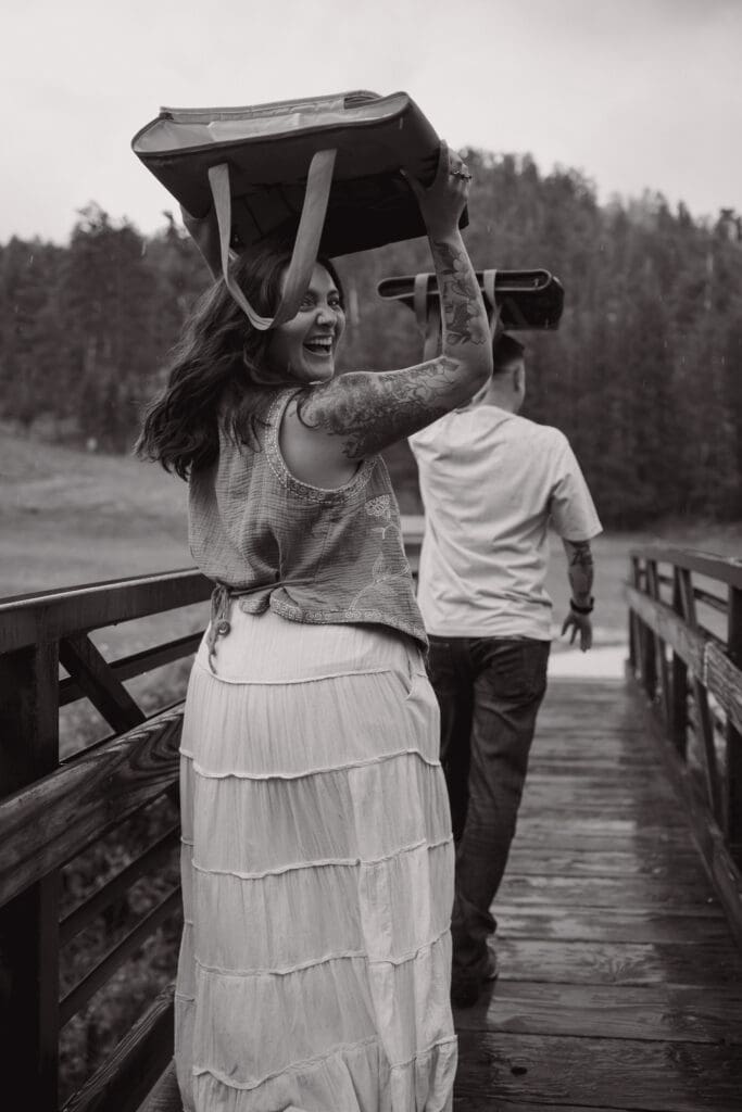 couple covering their head from the rain