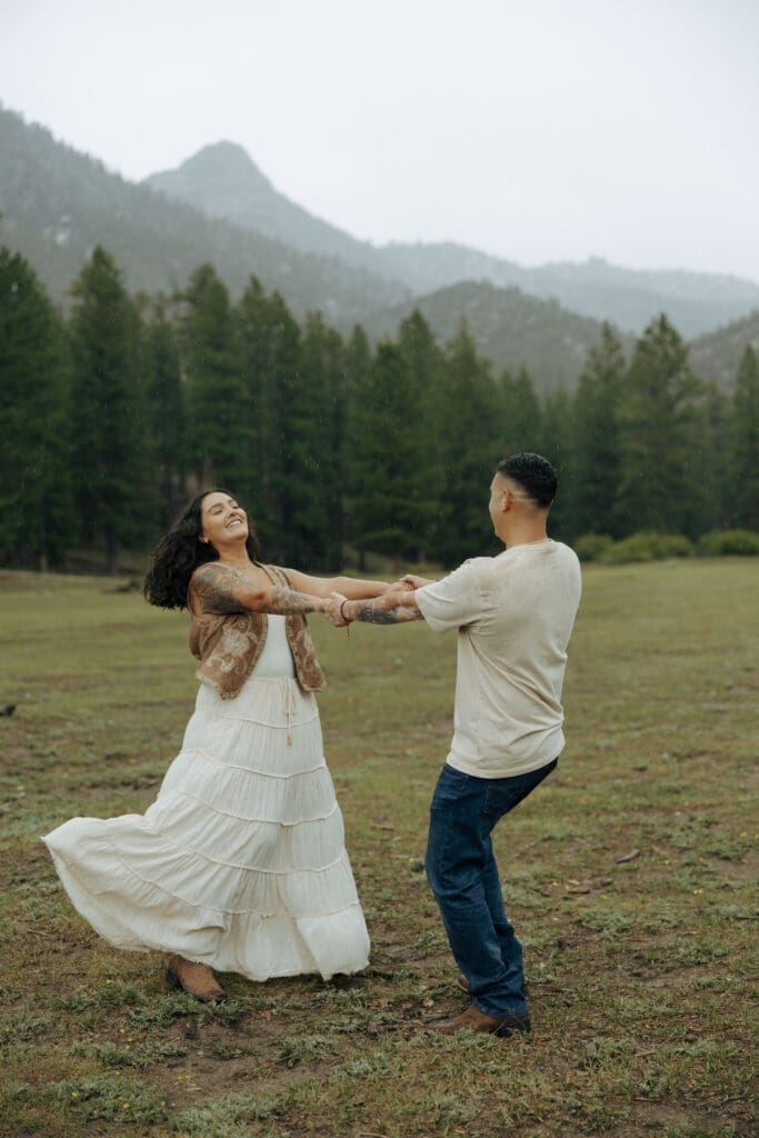 couple spinning in the rain