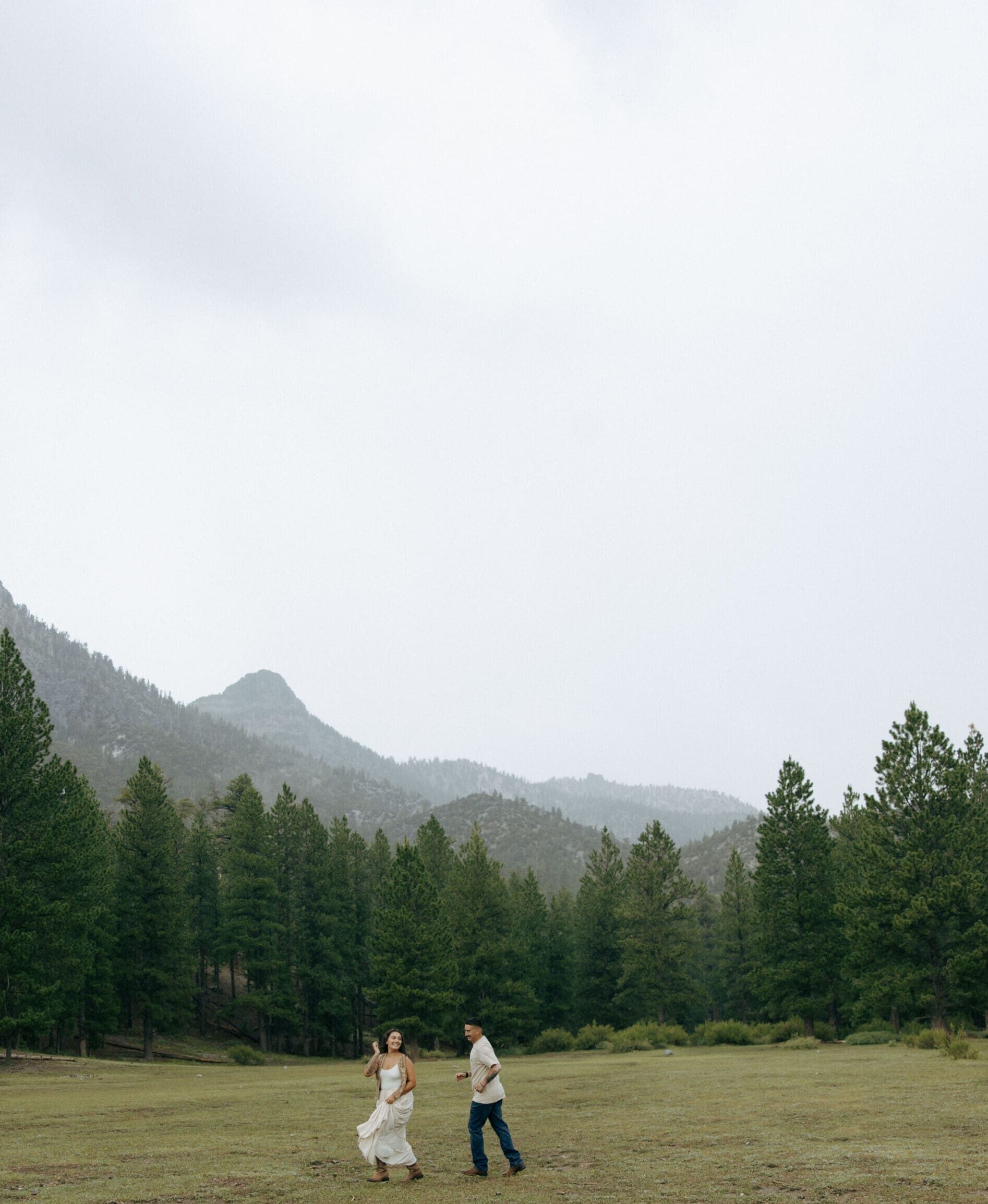 couple playing tag in the rain