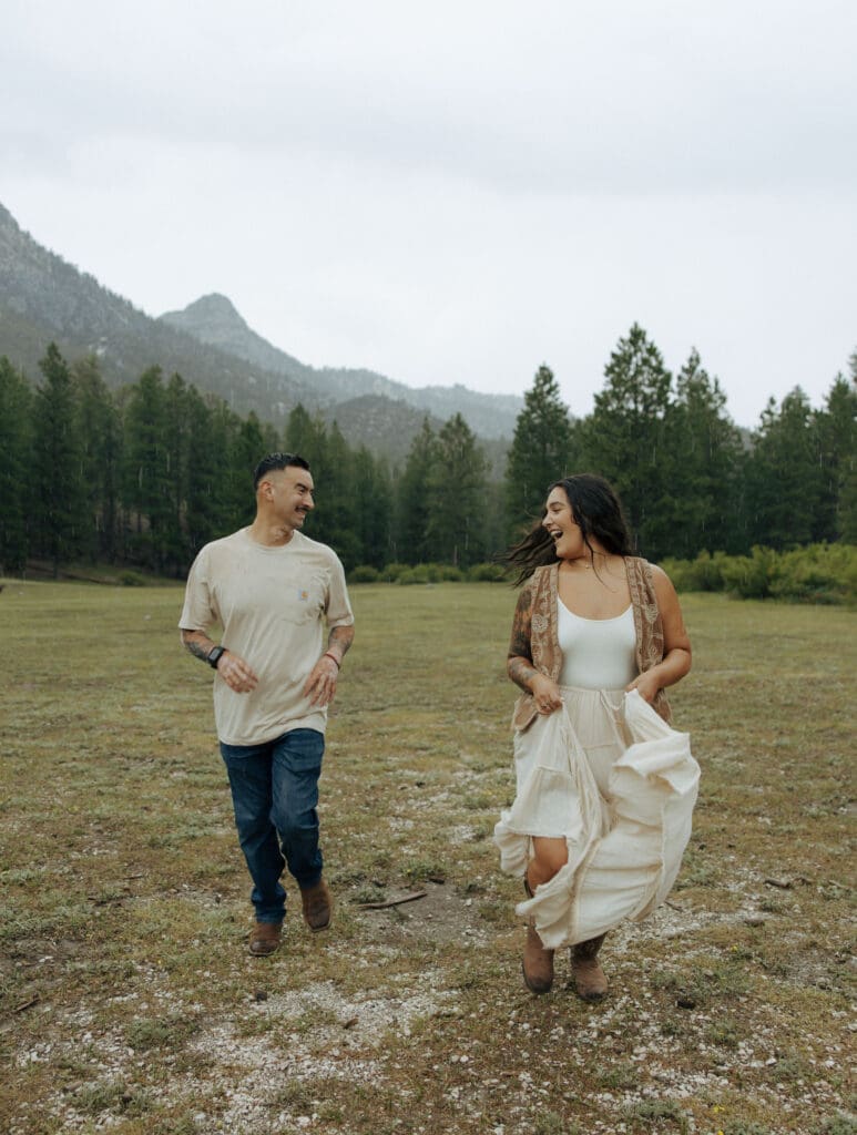 couple playing tag in the forest