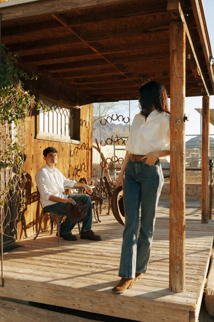couples looking at each other for western engagement photos in vegas at hold your horses las vegas