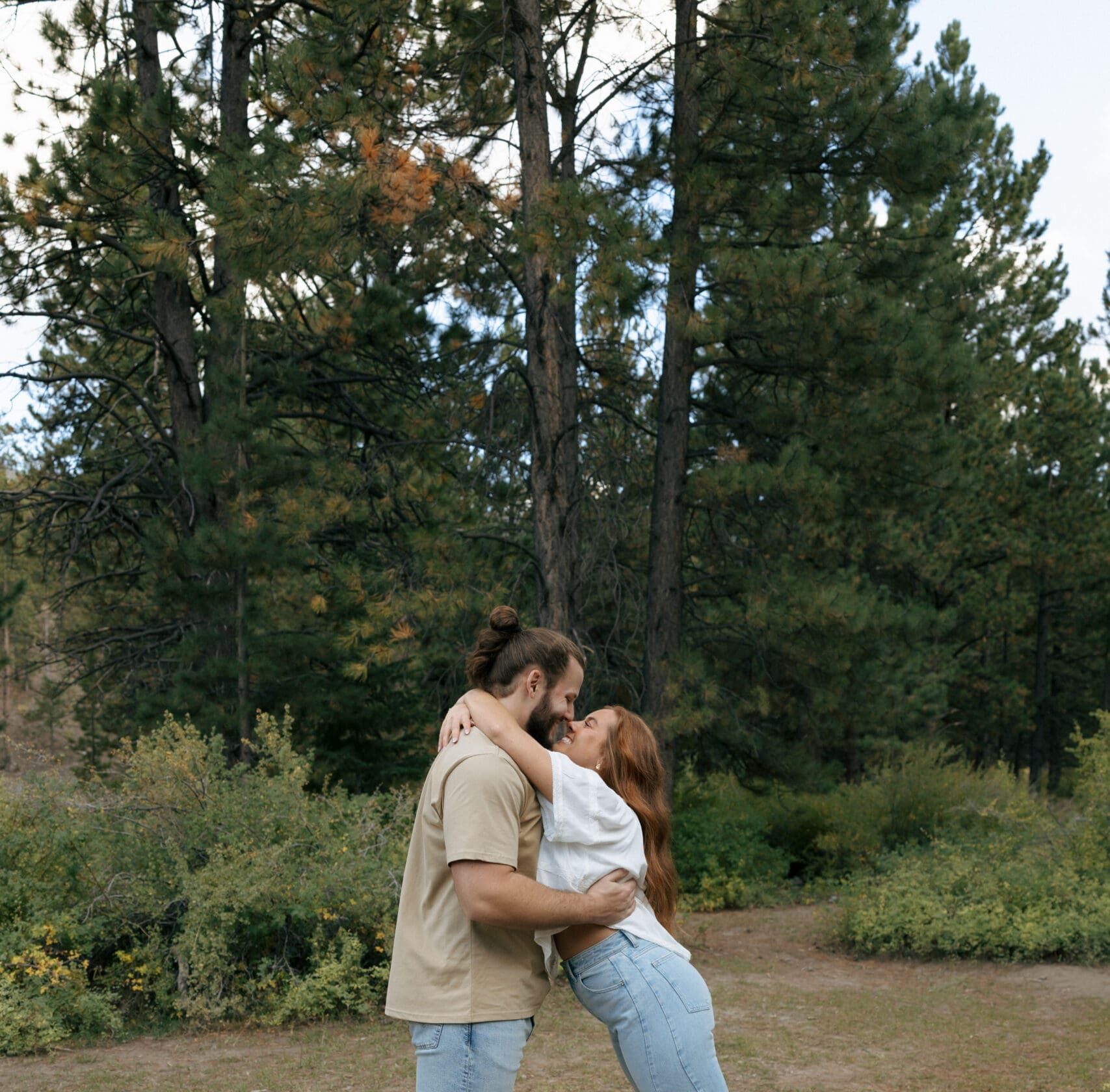 couple in forrest hugging