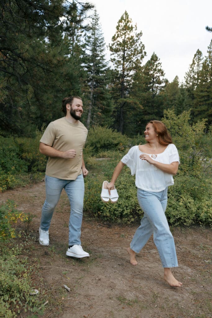 couple playing tag in the mountains