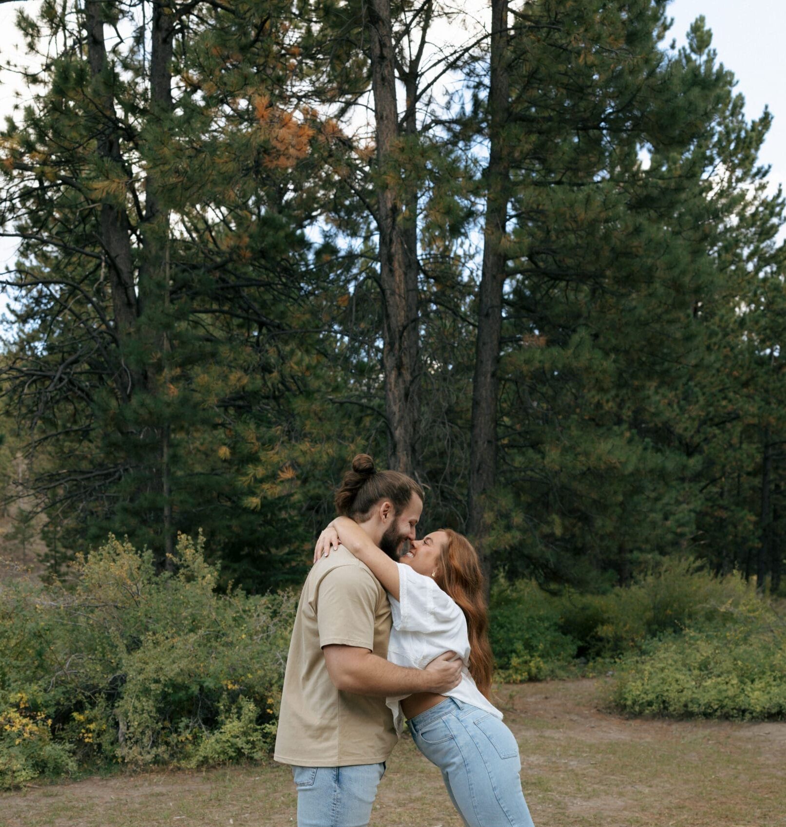 couple in forrest hugging