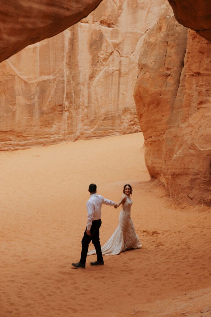 groom walking past bride captured by west coast elopement photographer