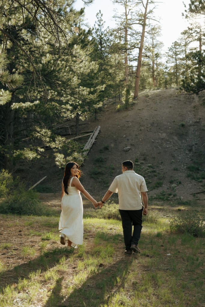 couple walking in outdoor location for engagement photos las vegas