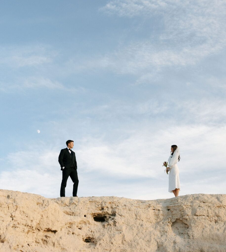 couple standing on cliff at tule springs fossil beds