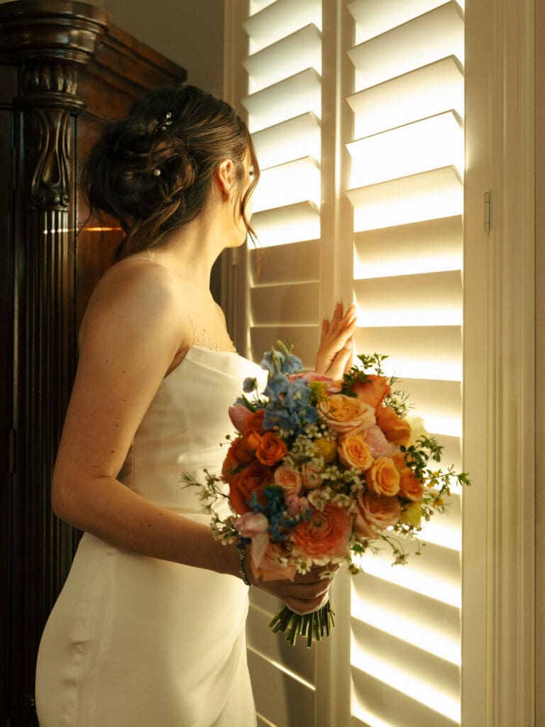 bride holding spring bouqet