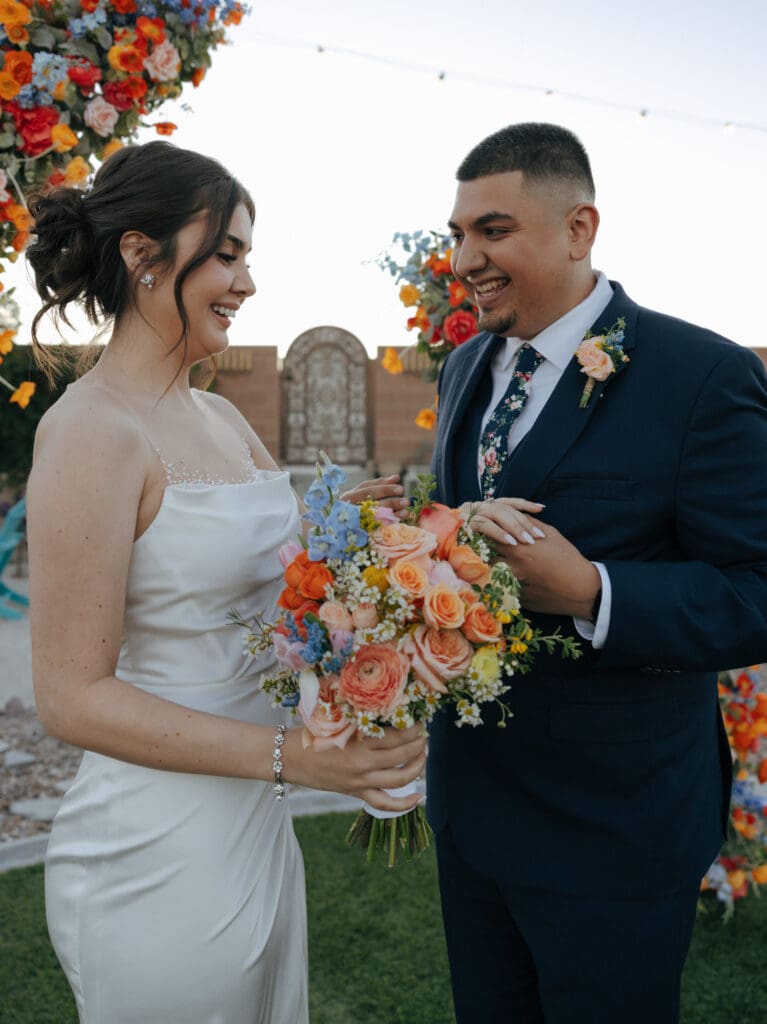 bride and groom laughing together