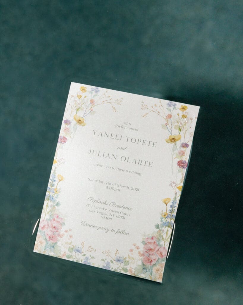 spring wedding invitation floating in water