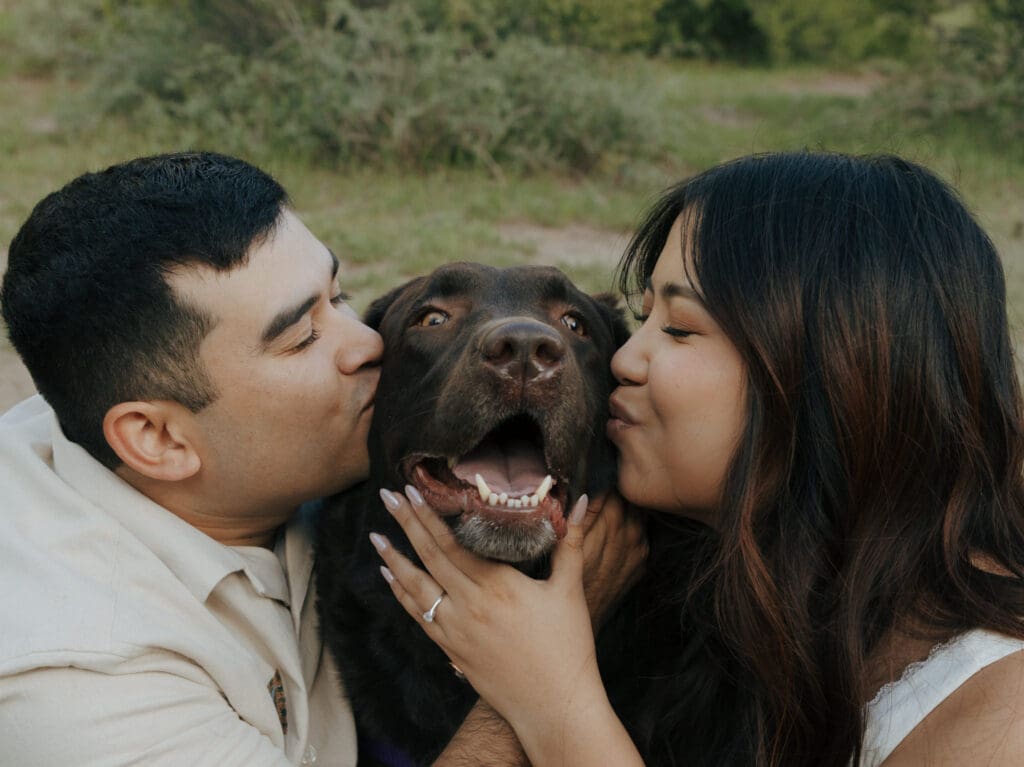 couple kissing their dogs face in mt charleston