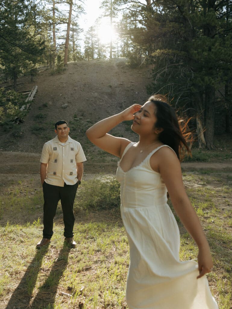 man looking at his fiance while he's in focus