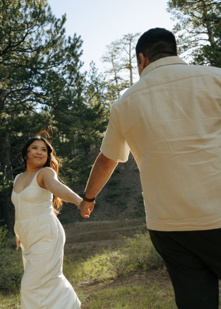 couple playing during their engagement photos