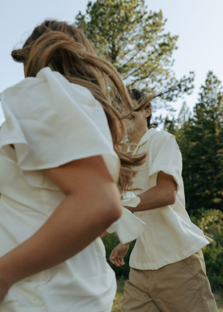 man and woman running past the camera
