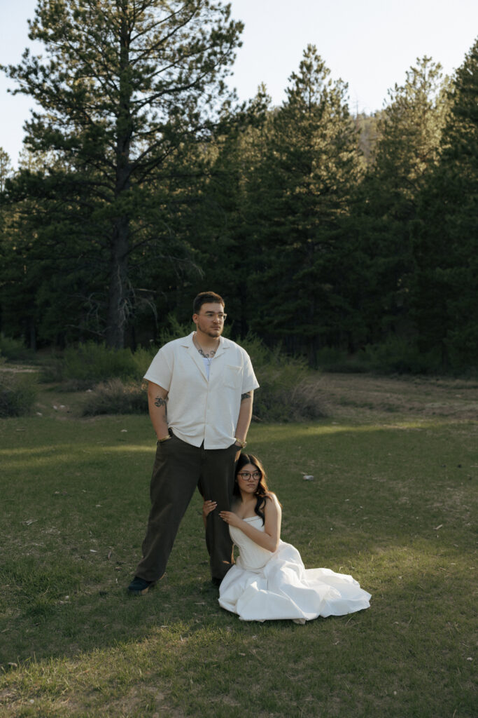 couple posing for editorial engagement photos in las vegas at lee meadows