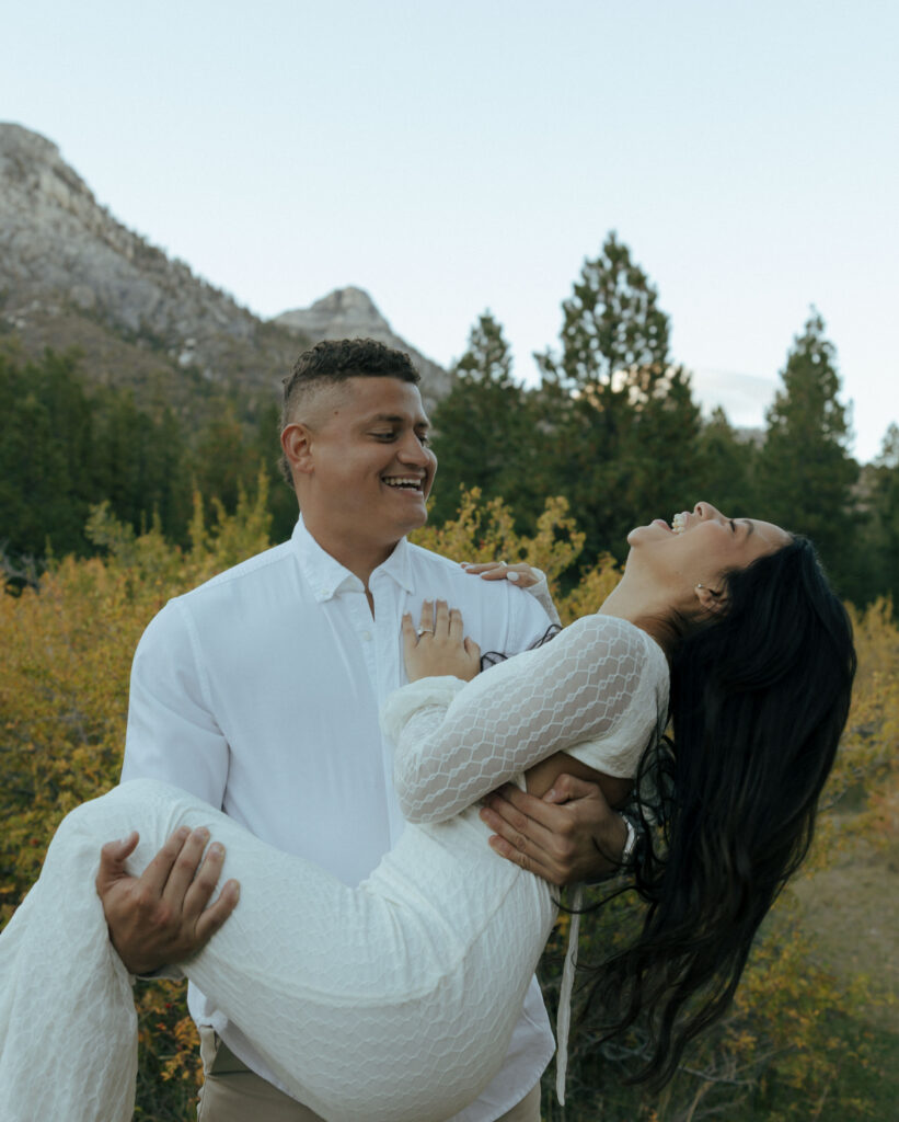 man holding woman as they both laugh at lee meadows