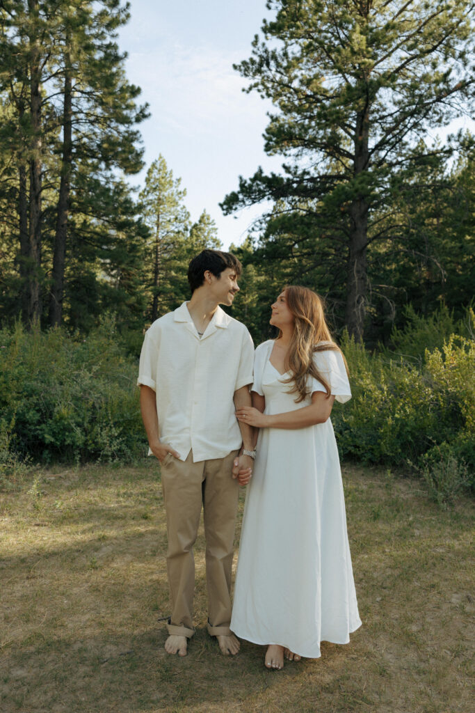 couple smiling at each other for their las vegas engagement photos