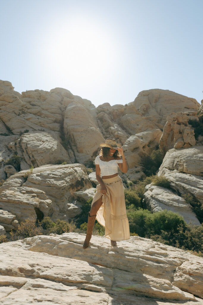 woman laughing standing at red rock canyon