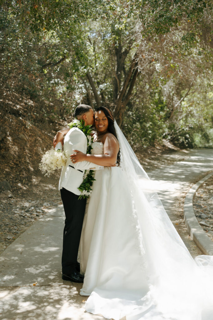bride and groom posing for wedding portraits at eagle glen golf club