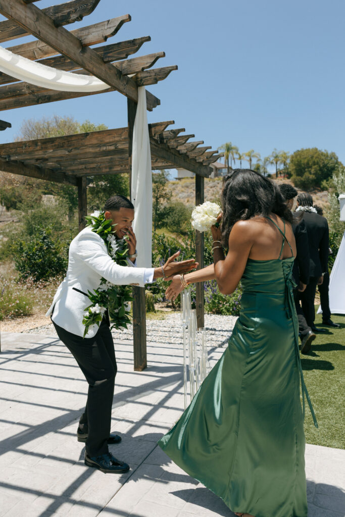 groom and bridesmaid handshake