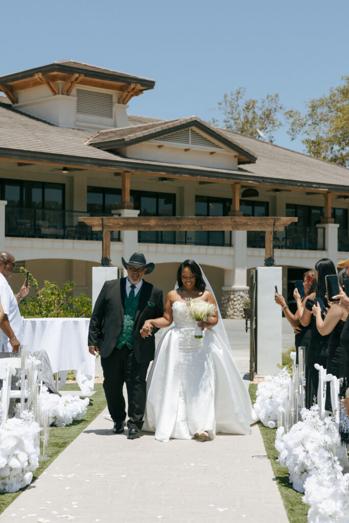 bride and father walking down aisle in corona california