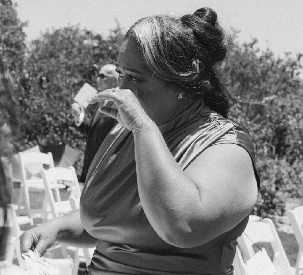 mother of the bride crying during ceremony