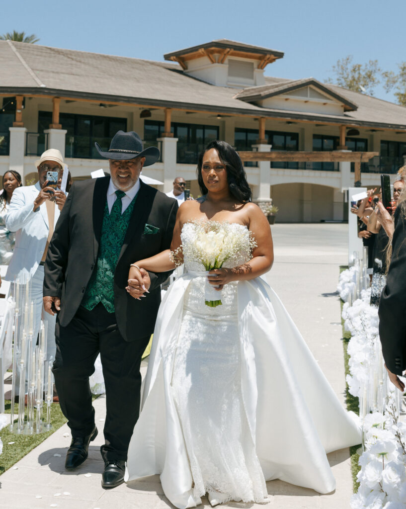 bride and dad walking down aisle at eagle glen golf club