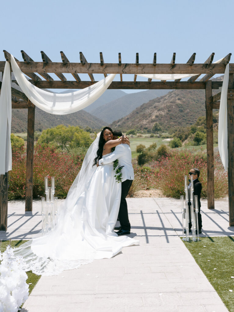 bride and groom hugging after ceremony