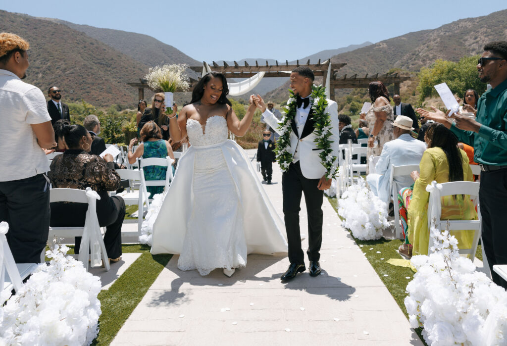 bride and groom walking back down aisle at eagle glen golf club