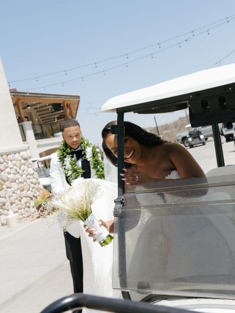 couple getting into golf cart