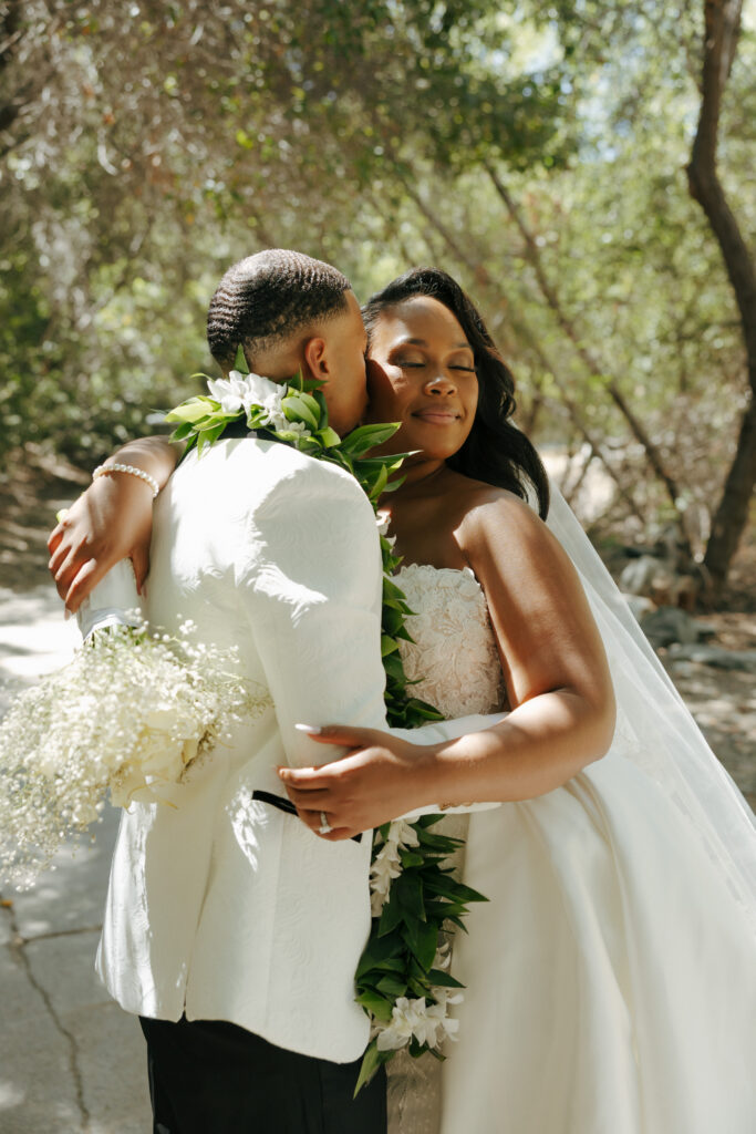 groom kissing brides cheek