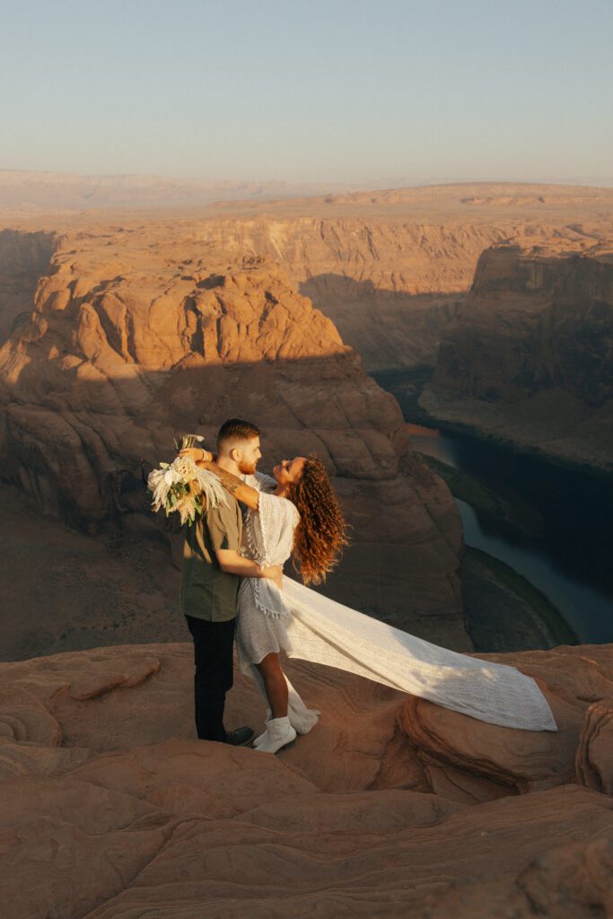 couple posing for boho horseshoe bend elopement