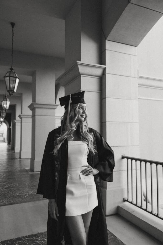 woman posing for graduation photos at lake las vegas