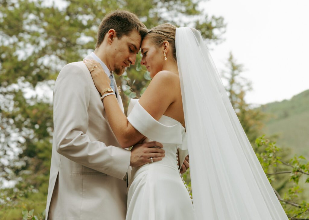bride and groom touching foreheads