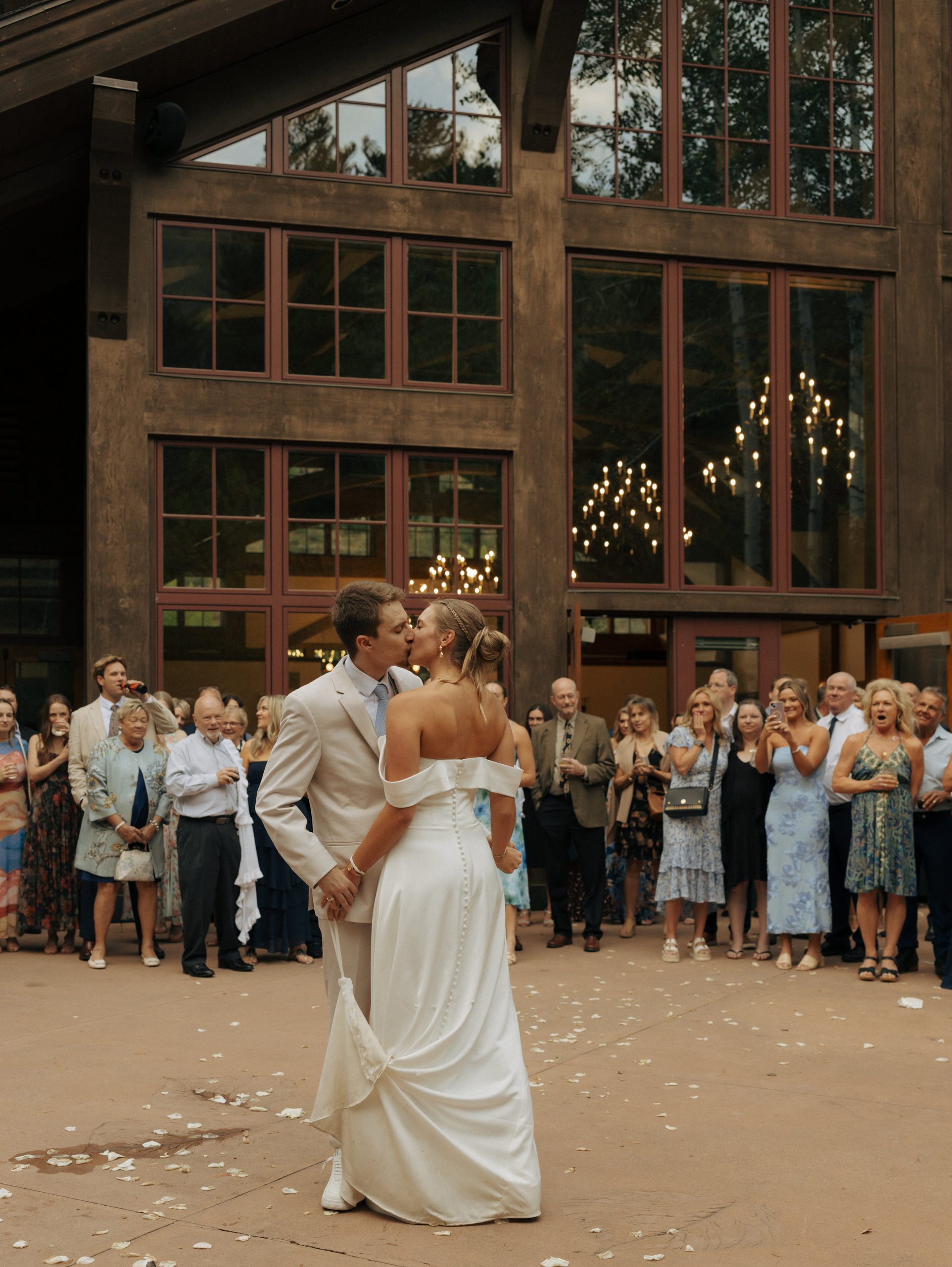 bride and groom kissing during their first dance at donovan pavilion in vail colorado
