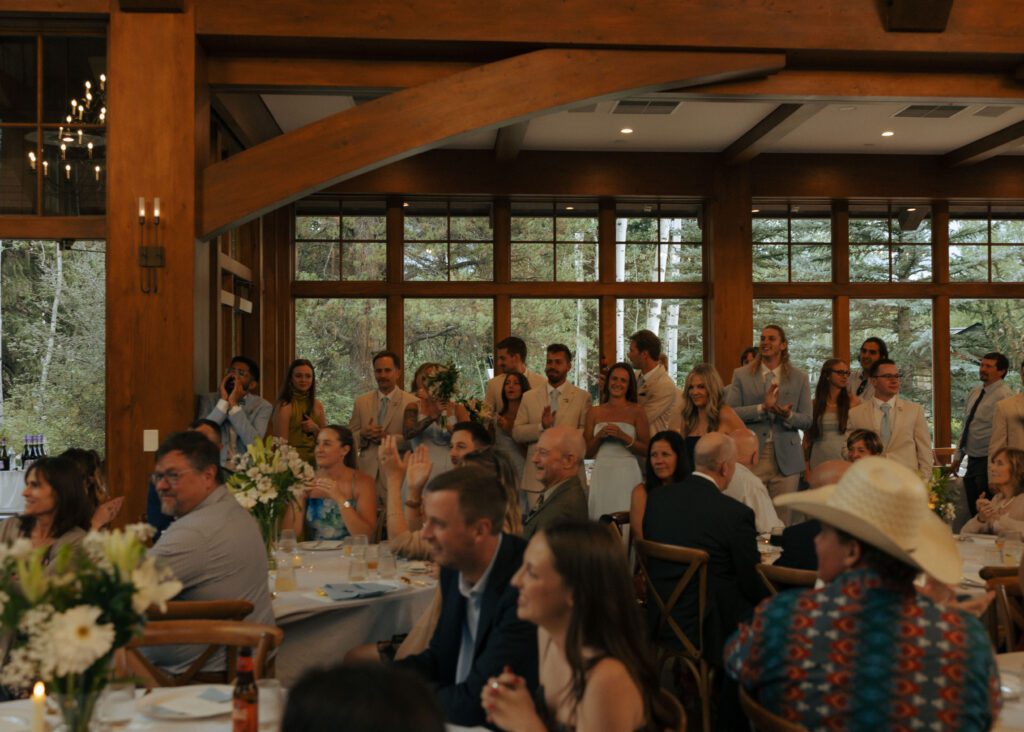 guests listening to wedding speeches during micro wedding at donovan pavilion