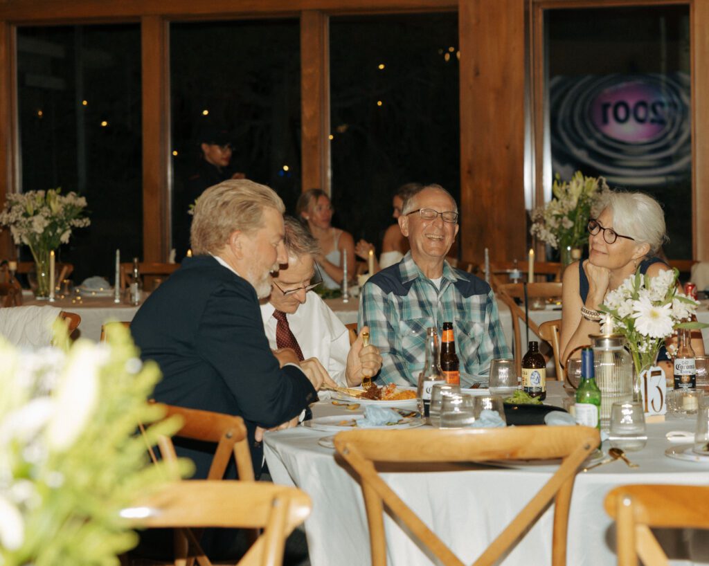 grandparents laughing at wedding reception
