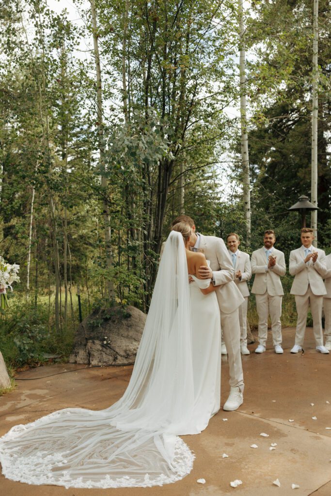 bride and groom sharing their first kiss at donovan pavilion