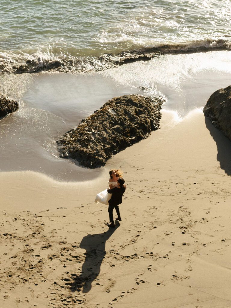 bride and groom sharing their first dance on secret beach in oregon